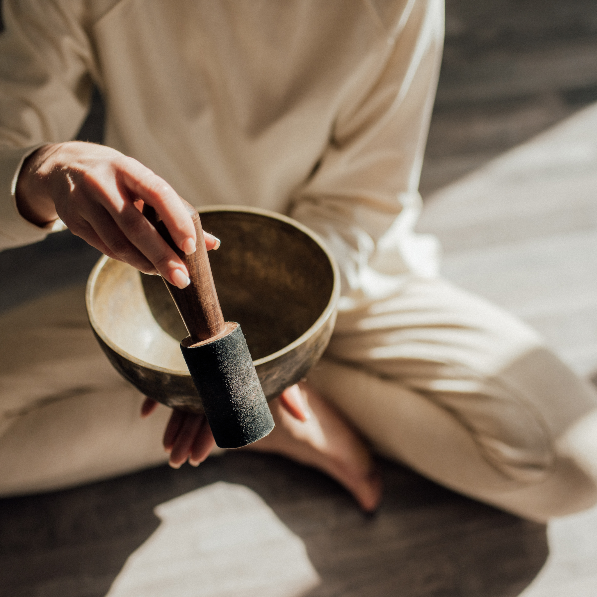 Person mixing ingredients in a bowl with a wooden spoon.