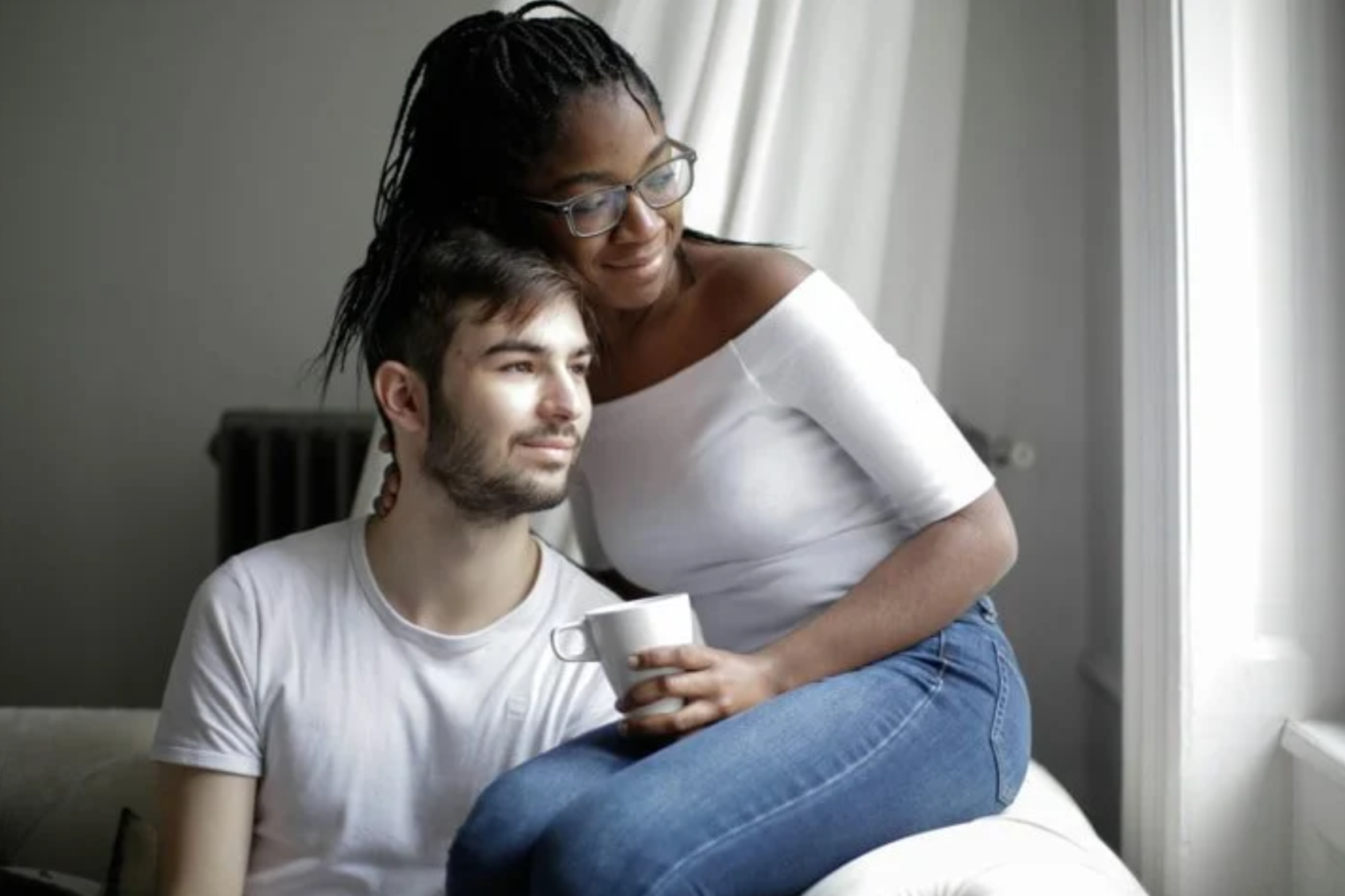 a couple sitting together with coffee