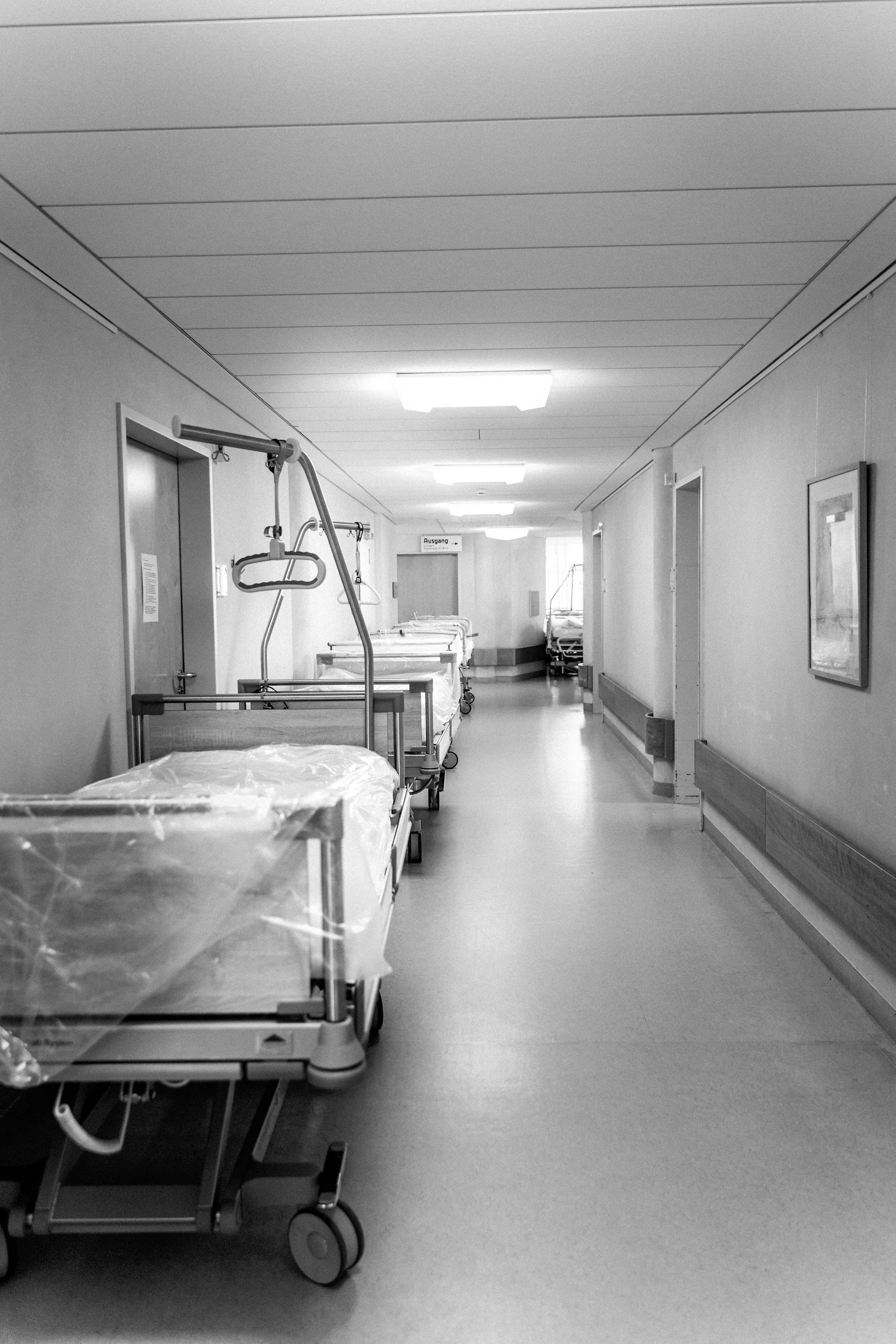 Hospital corridor representing healthcare facility support and occupied building coordination.
