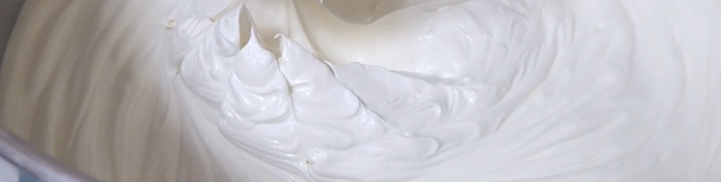 	
Close-up of whipped body butter in a mixing bowl.