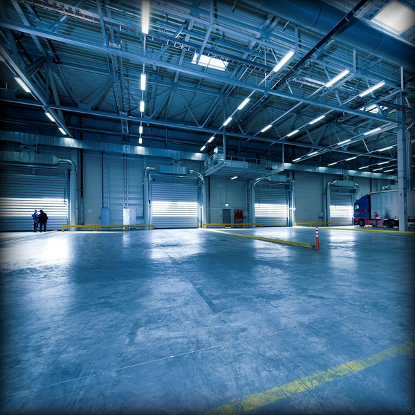 Commercial warehouse facility equipped with A/Coe in-building cellular booster and DAS infrastructure.