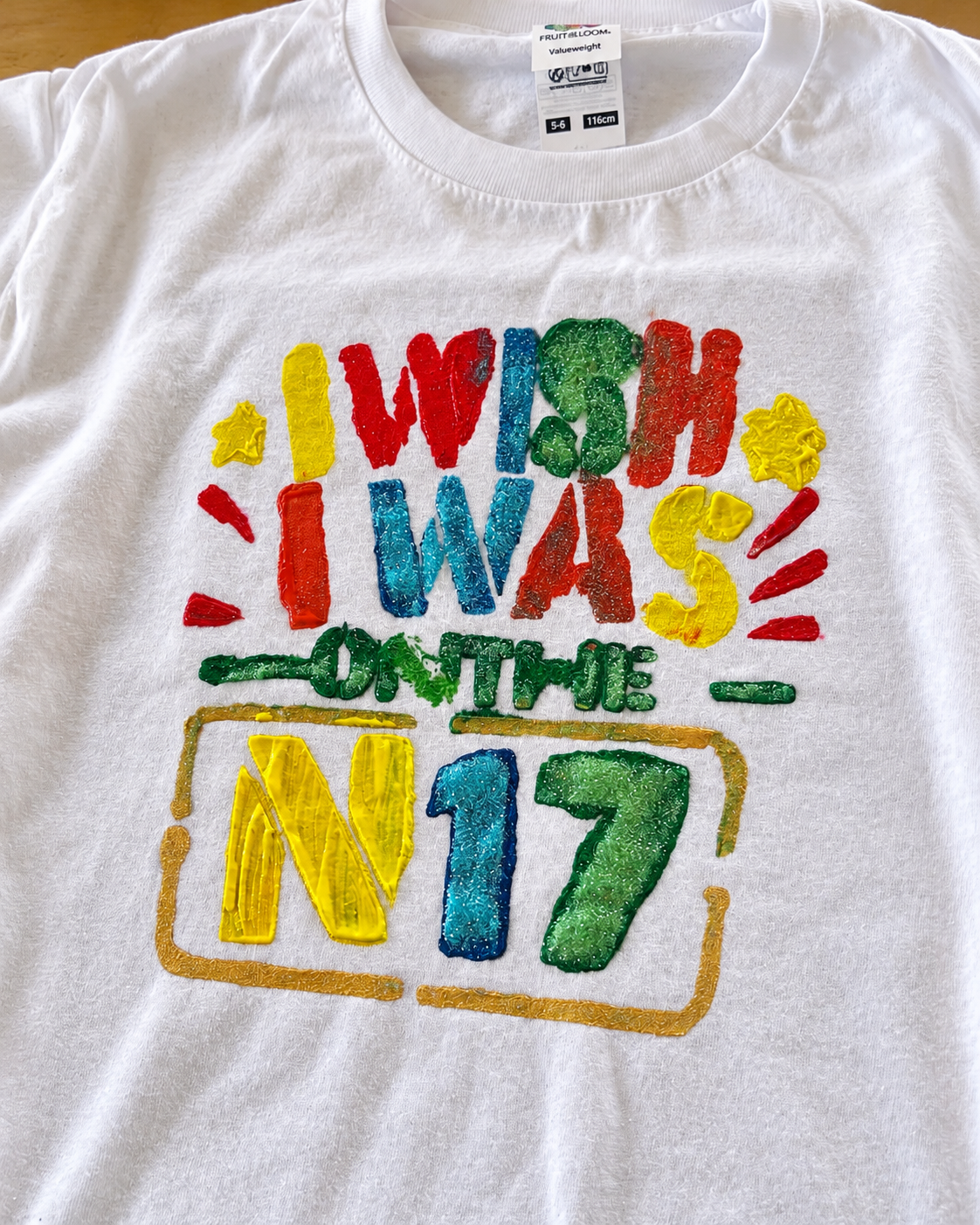 Colorful decorated T-shirt with the text 'Wish I Was On The N 17' in bright colors.