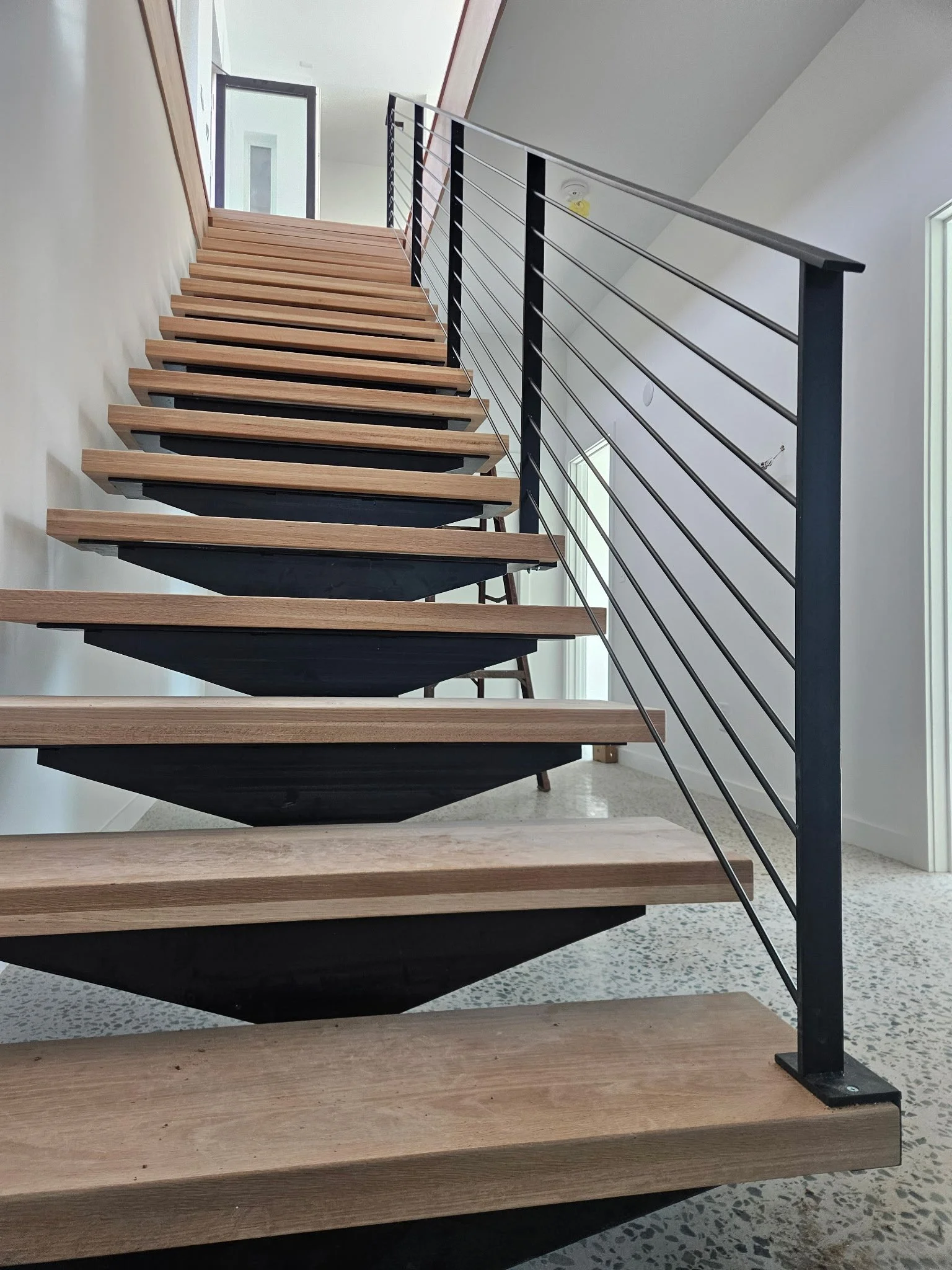 mono-stringer stairs & railing • Arielle Schechter - architect • Newphire - builder