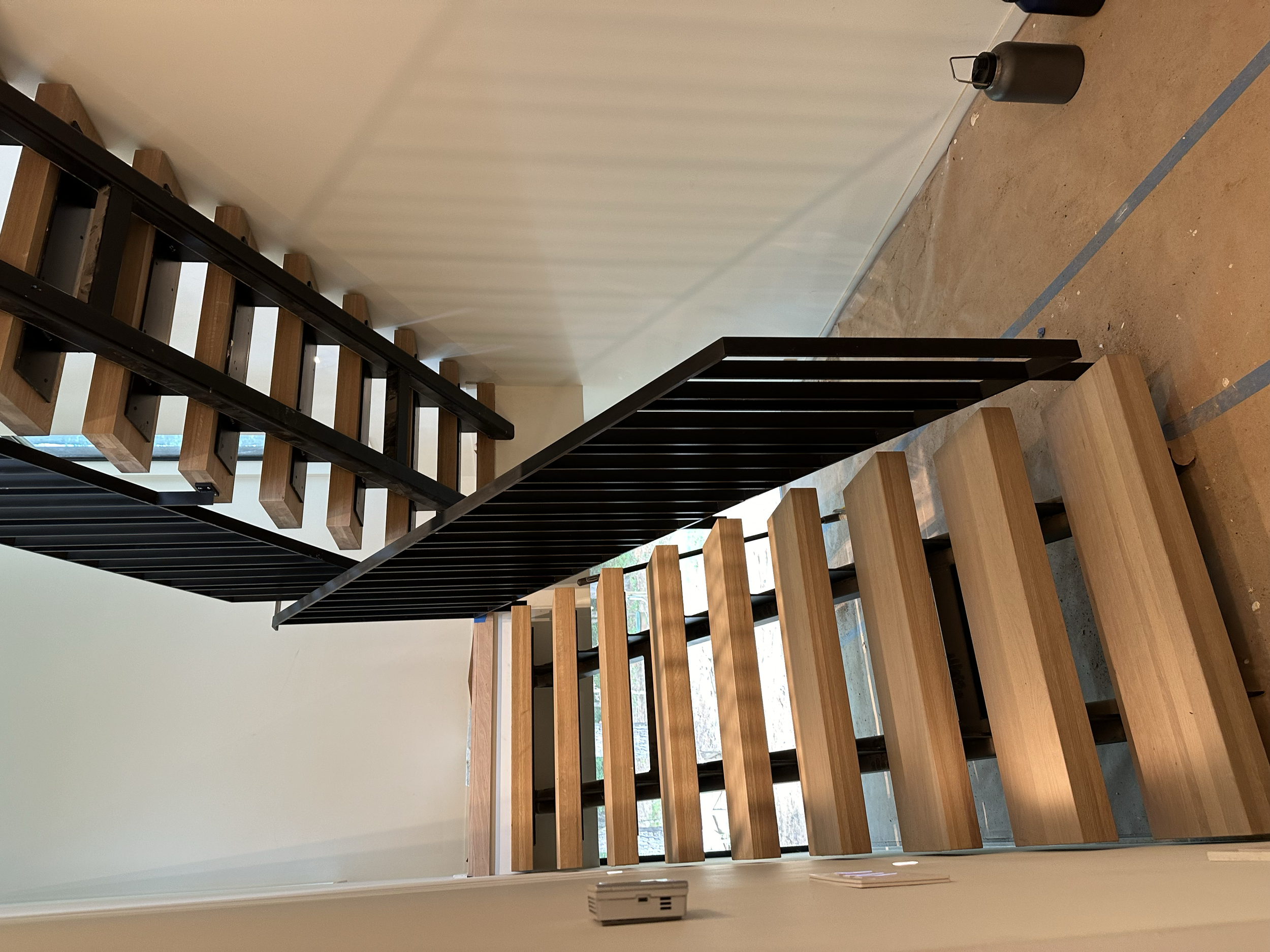 floating steel staircase stringers with guardrail • Vellum Architecture & Design • Newphire - builder