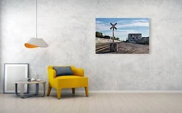 Edge of the Yard fine art print displayed above a yellow chair and small table