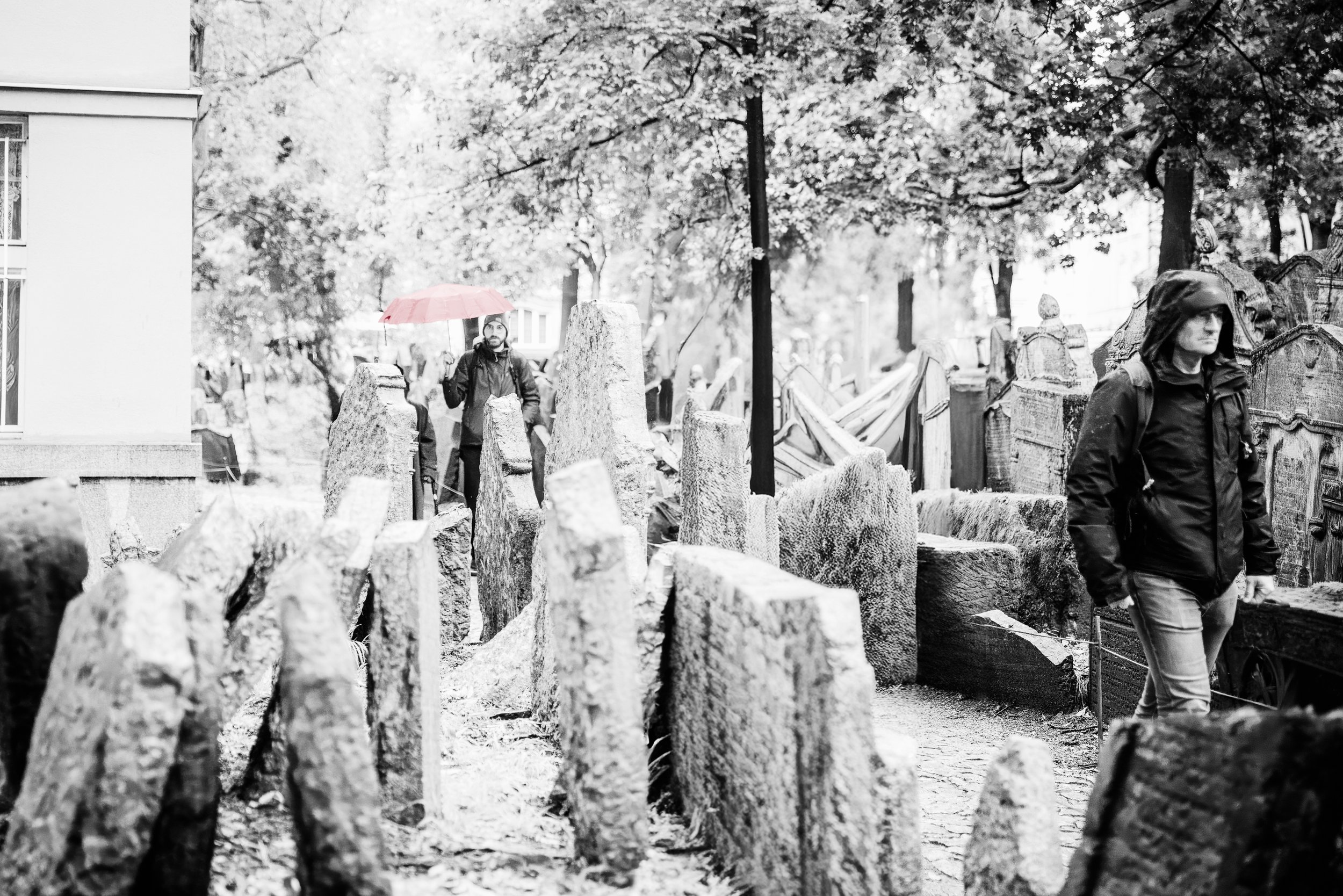 Black and white photography of the Old Jewish Cemetery in Prague, featuring the rhythmic, crowded headstones of the Josefov district in a minimalist, high-contrast style.