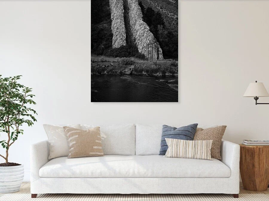 What the Gate Warns fine art print framed above a sofa in a living room