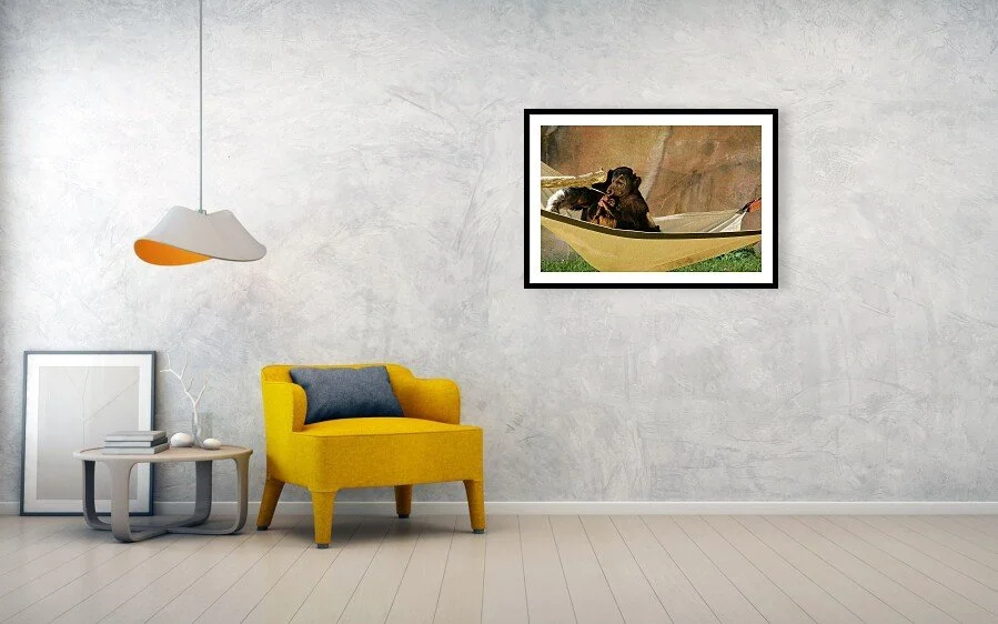 Small Hands fine art print displayed above a yellow chair and small table