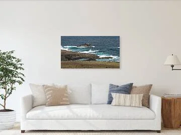 Where the Trade Winds Break fine art print framed above a sofa in a living room