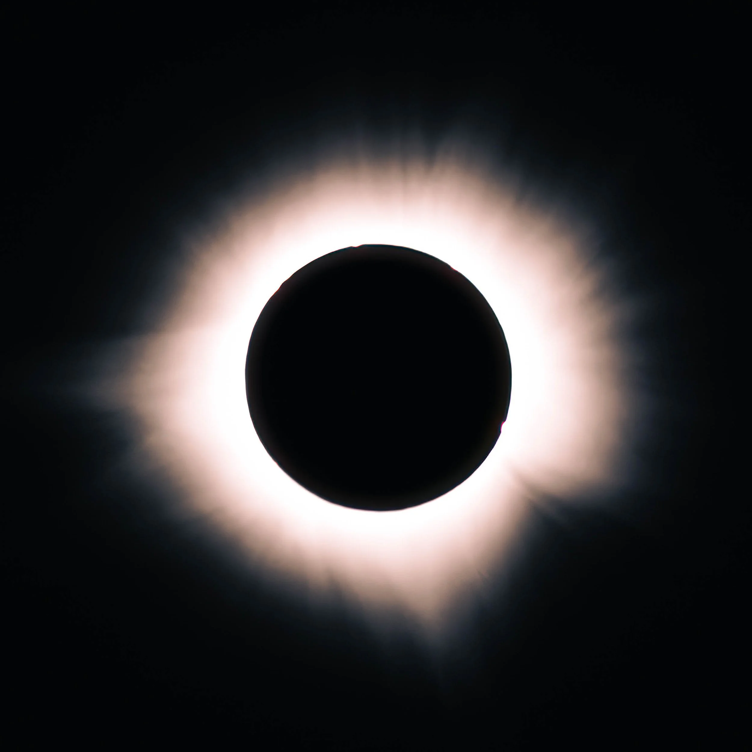 Four-image solar eclipse sequence showing crescent phase, Bailey's Beads, Diamond Ring effect, and totality corona during the April 2024 total solar eclipse.