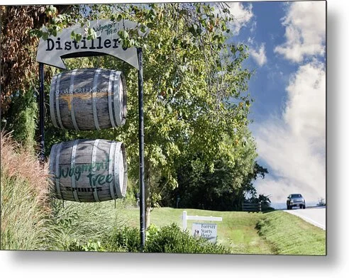 whiskey-barrels-and-distillery-sign-defiance-missouri-wine-country-robert-niemeier.jpg