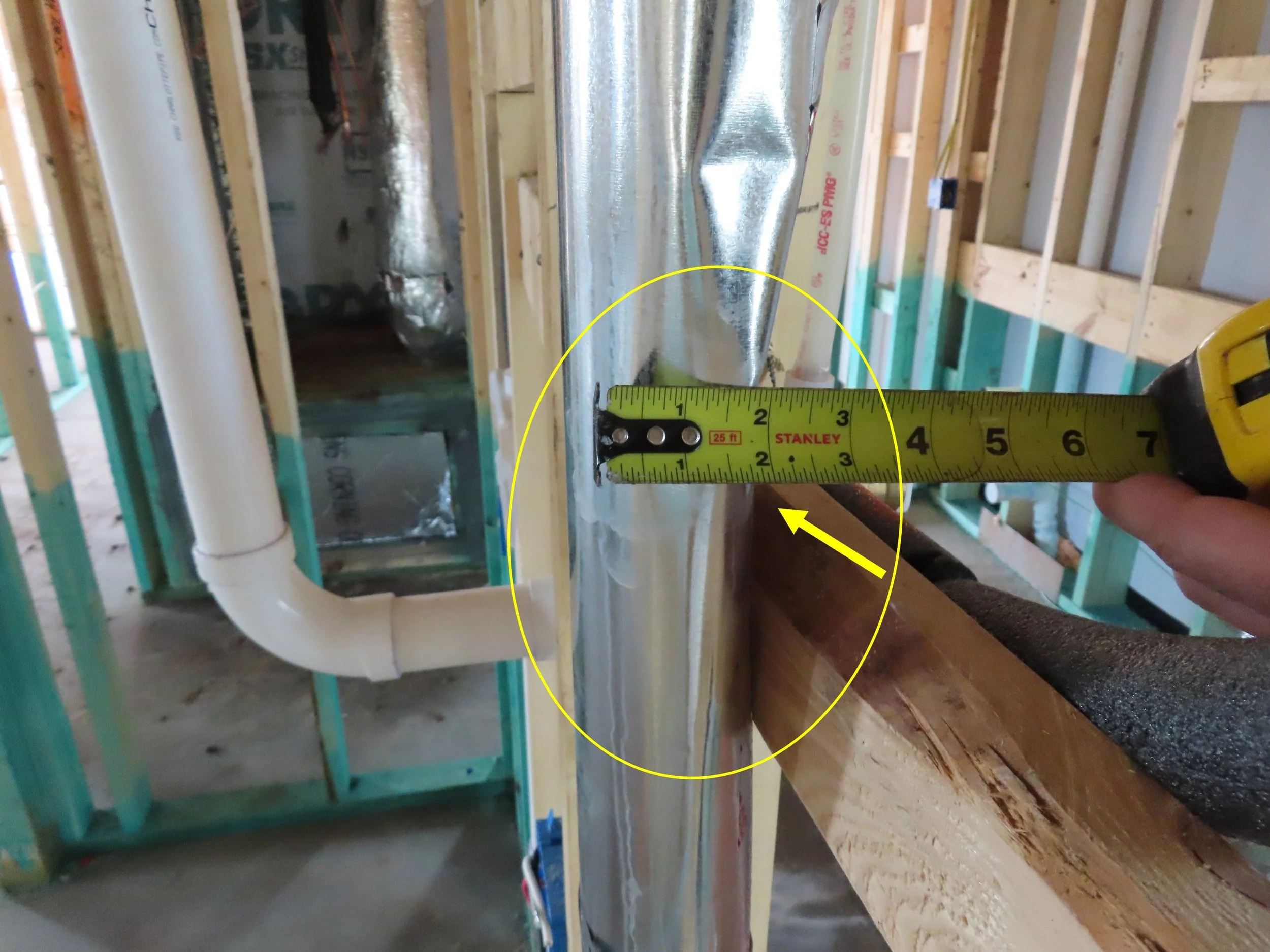A dryer vent tube that has been crushed to 2" in diameter, but still used in a home being built.