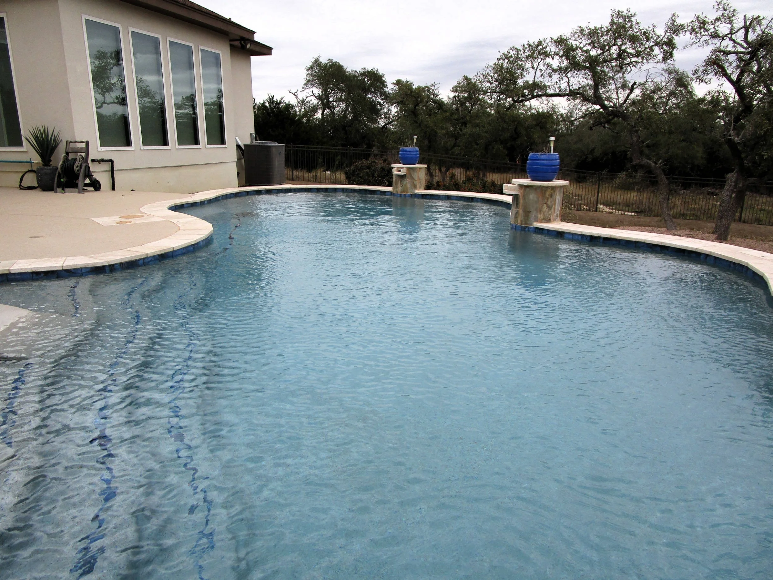 Swimming pool behind a house