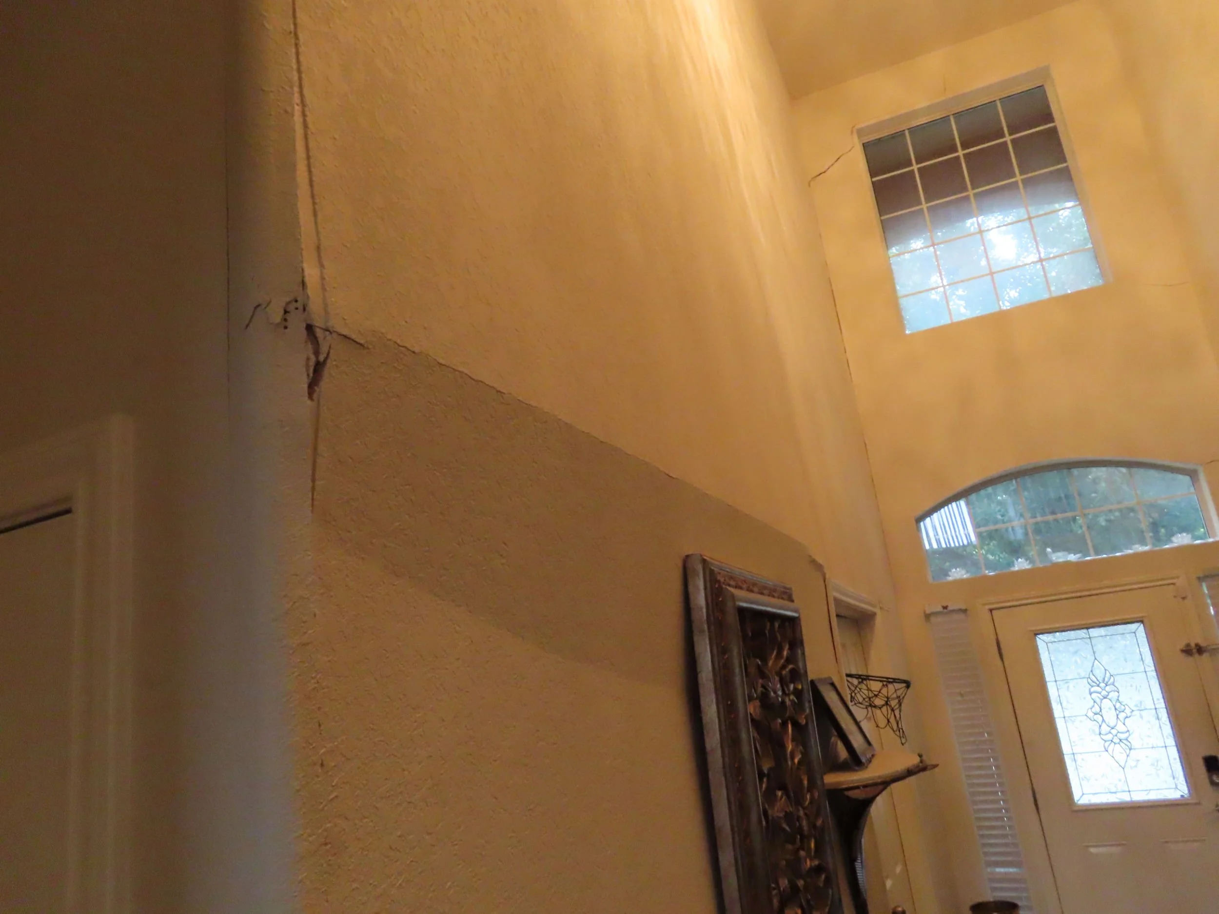 Sheetrock on wall that has buckled due to foundation issues