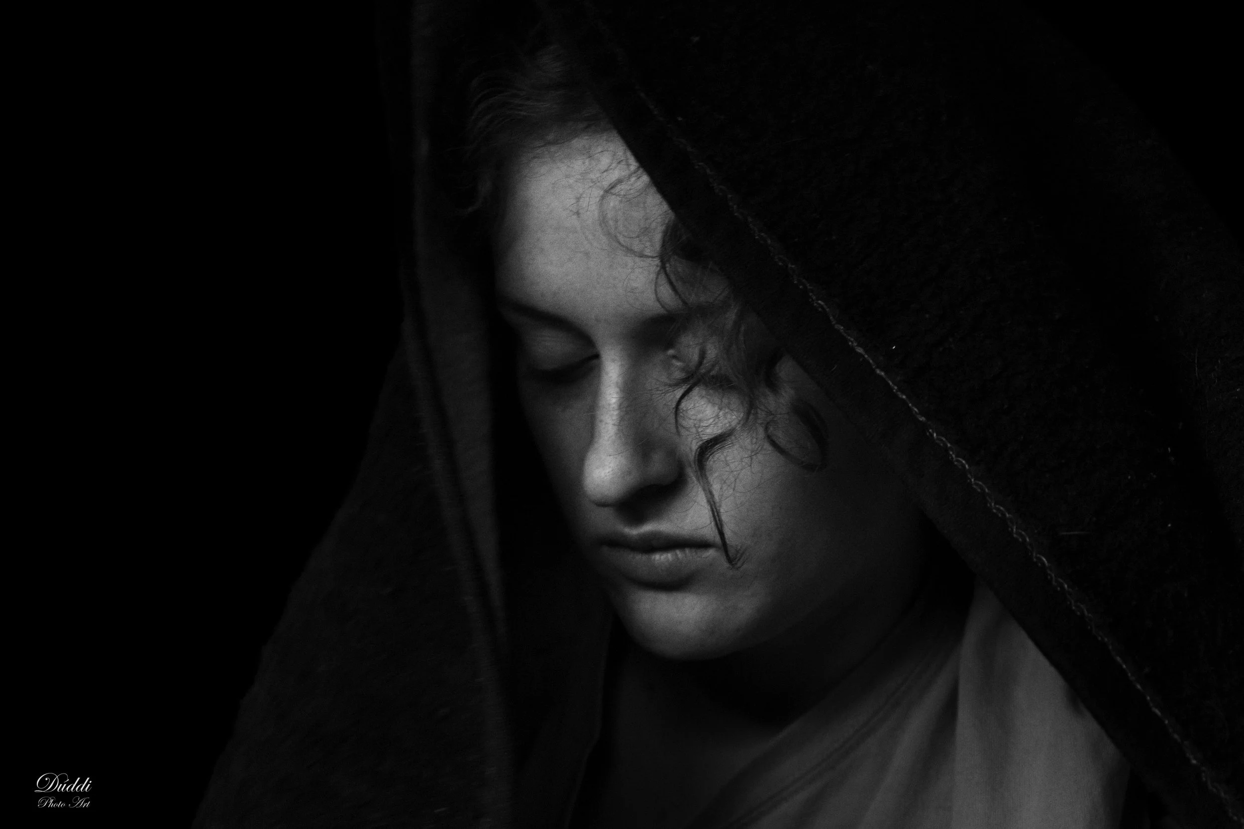 Black and white photo of a sad, young, woman.