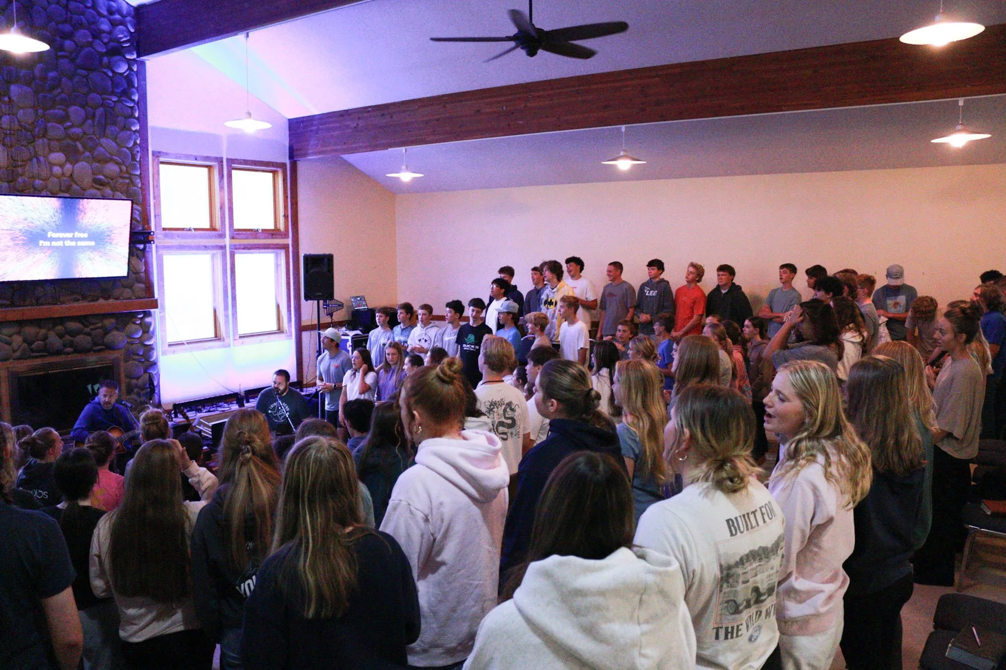 Trinity students singing in chapel