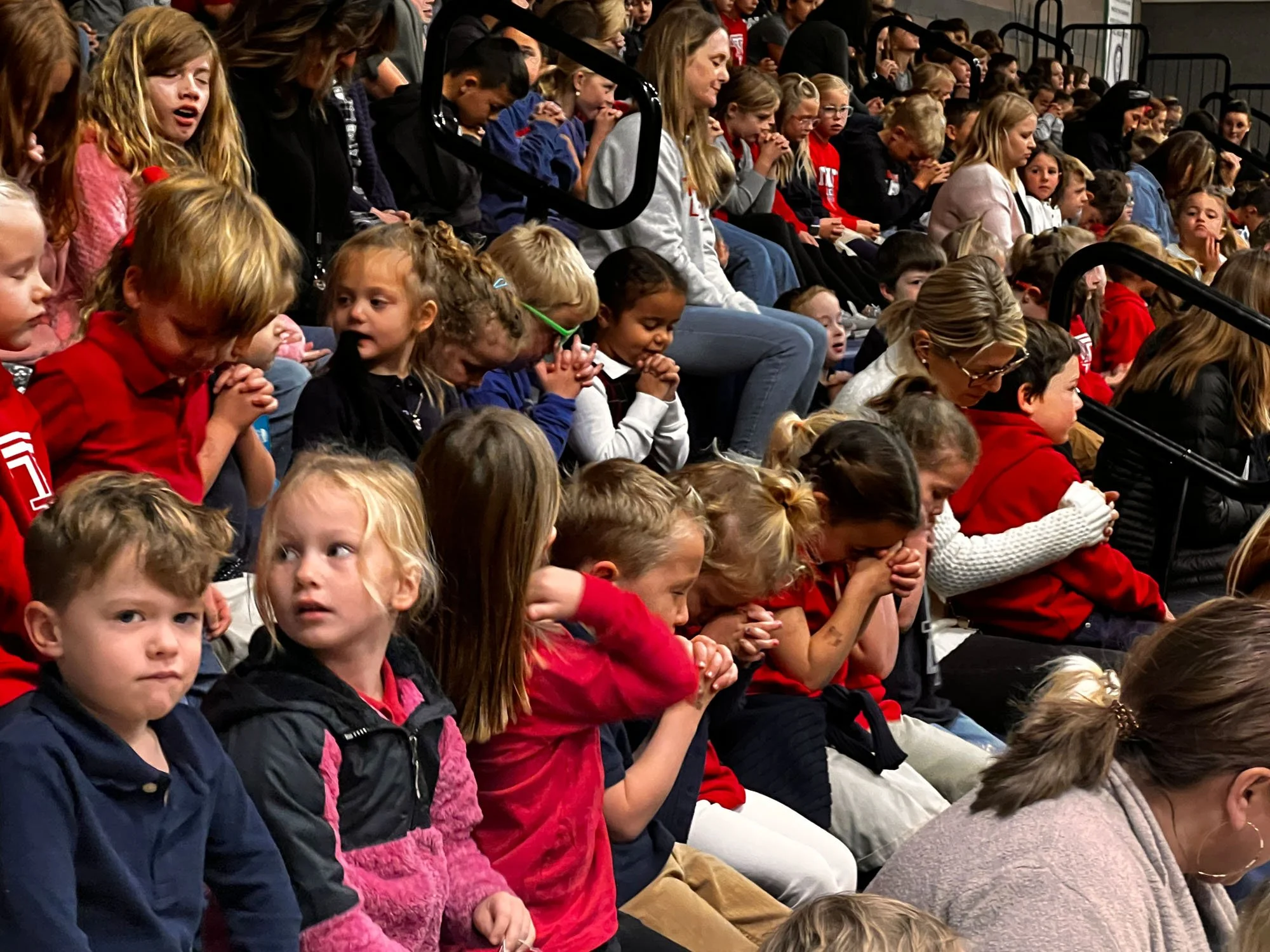 Young students praying together