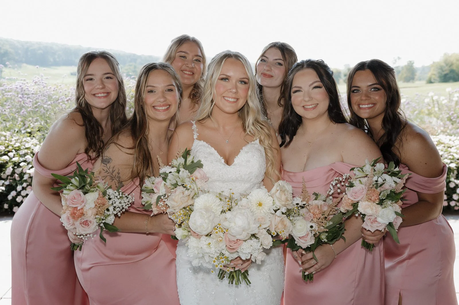Romantic bridal hairstyle and soft glam makeup for a Wisconsin wedding