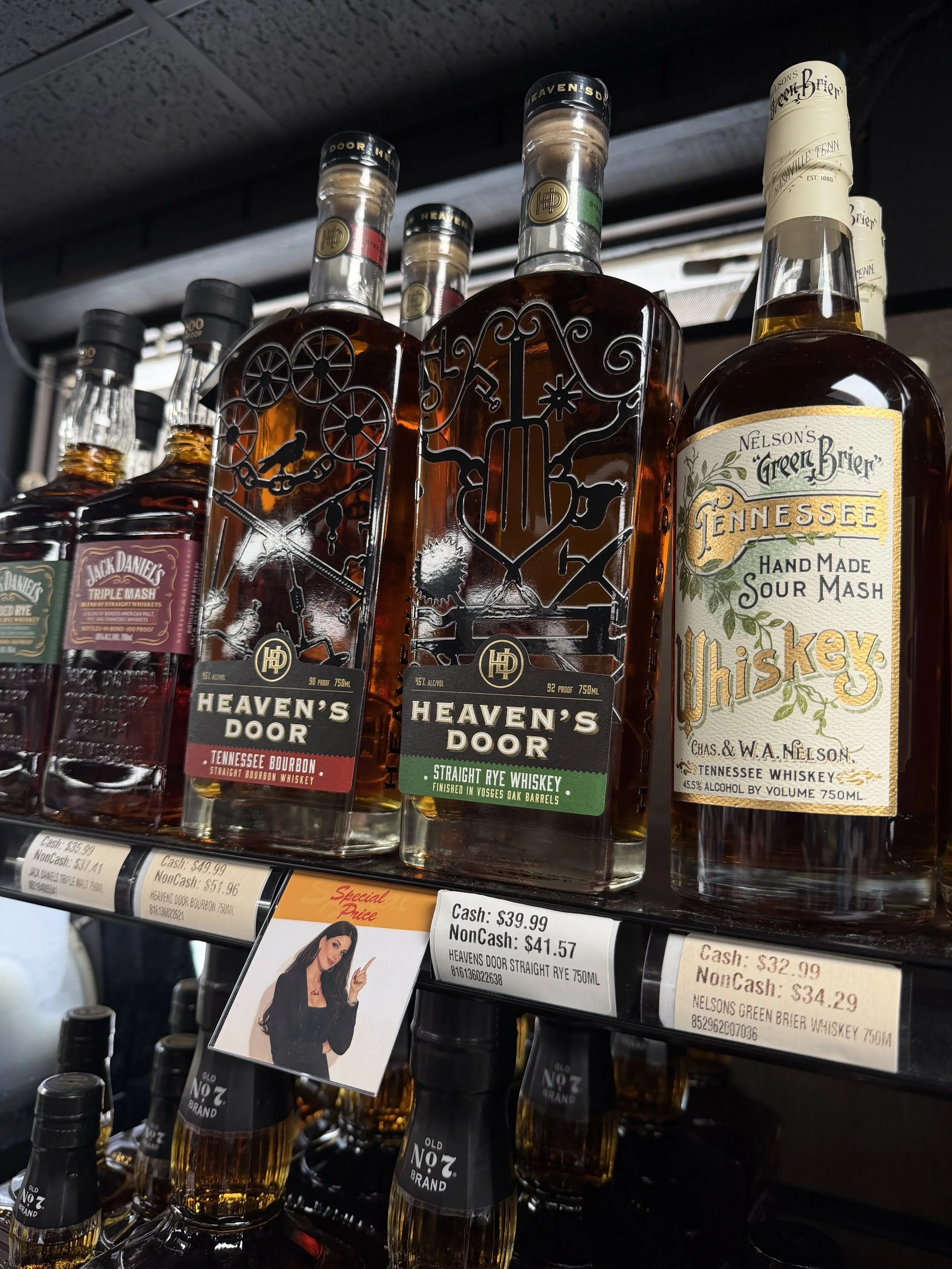 Cash's Liquors liquor rack photography with Branding label made by masion marketing house