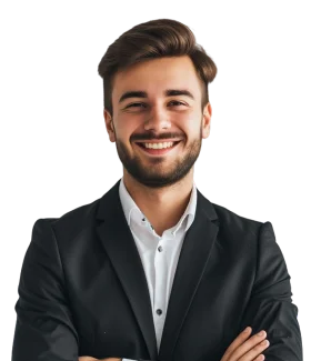 A smiling young man with dark hair and a beard, wearing a black suit and white shirt, standing with arms crossed against a white background.
