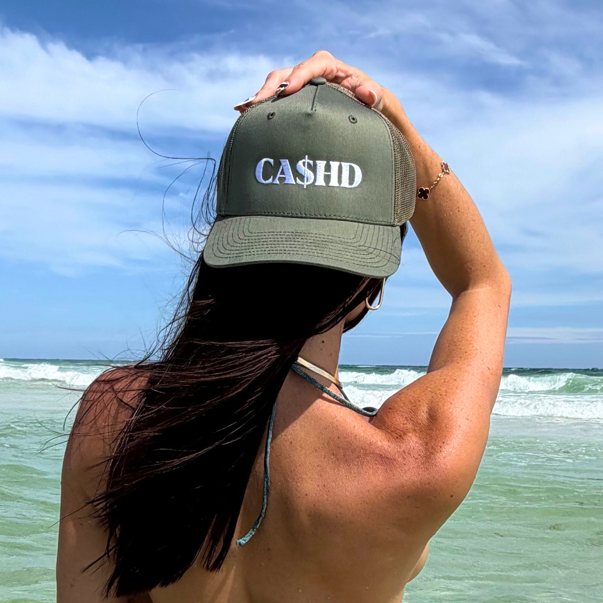 Cashd cap merch photoshoot at the beach for social posting and branding