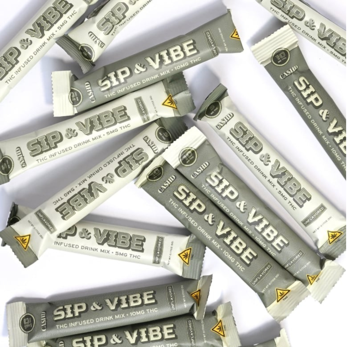 Multiple packets of Sip & Vibe THC infused drink mix with 10mg THC displayed on a white surface.
