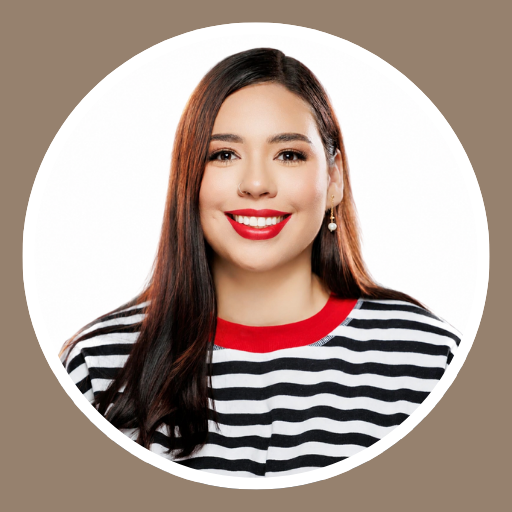 A woman with long, dark brown hair, wearing a black and white striped shirt with a red collar, smiling against a white circular background.