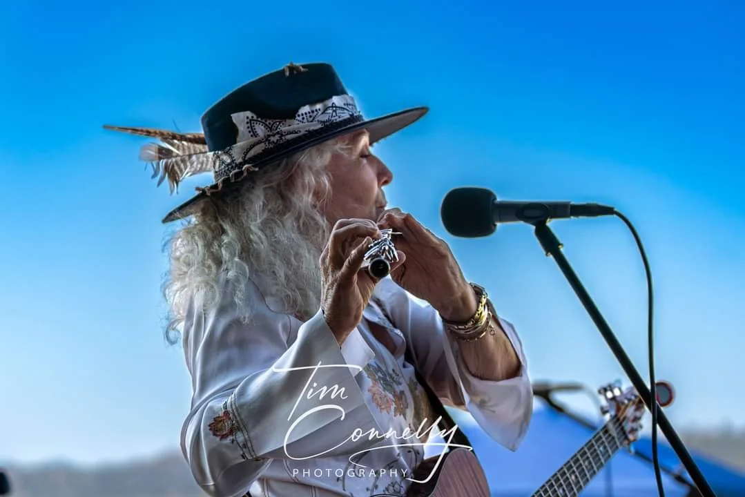 Flute, guitar, vocals — and the hat deserves its own encore.
