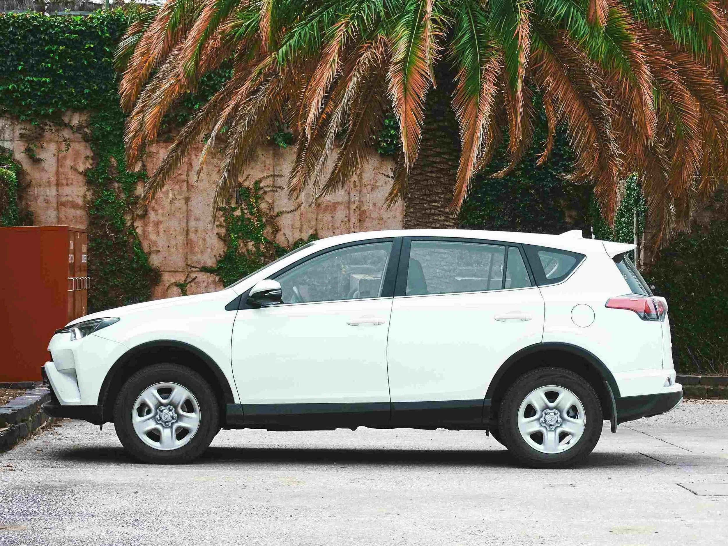 white SUV parked - st lucia