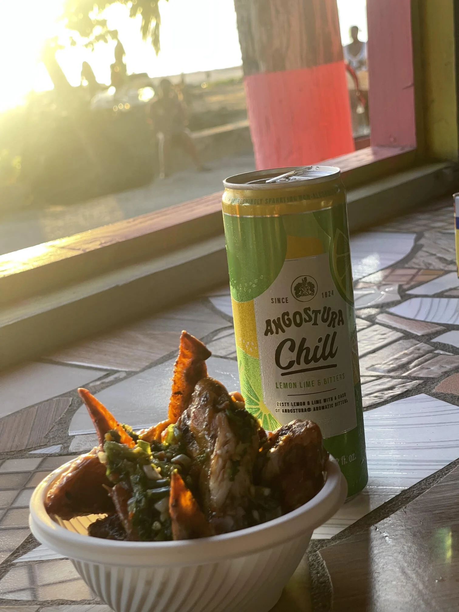 photo of local st lucian food with a drink - gros islet friday night street party
