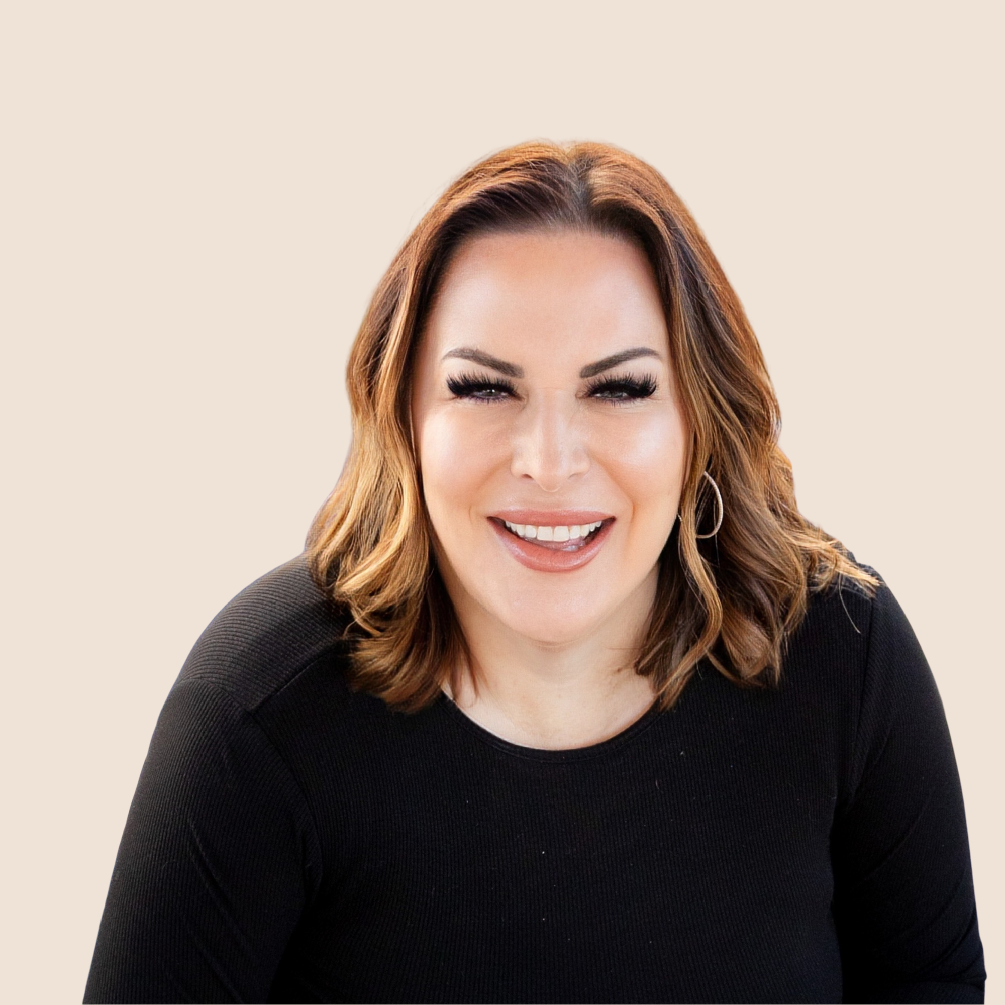Leadership coach, keynote speaker, and author Alexandra Gerritsen is smiling, wearing a black top and earrings, against a beige background.