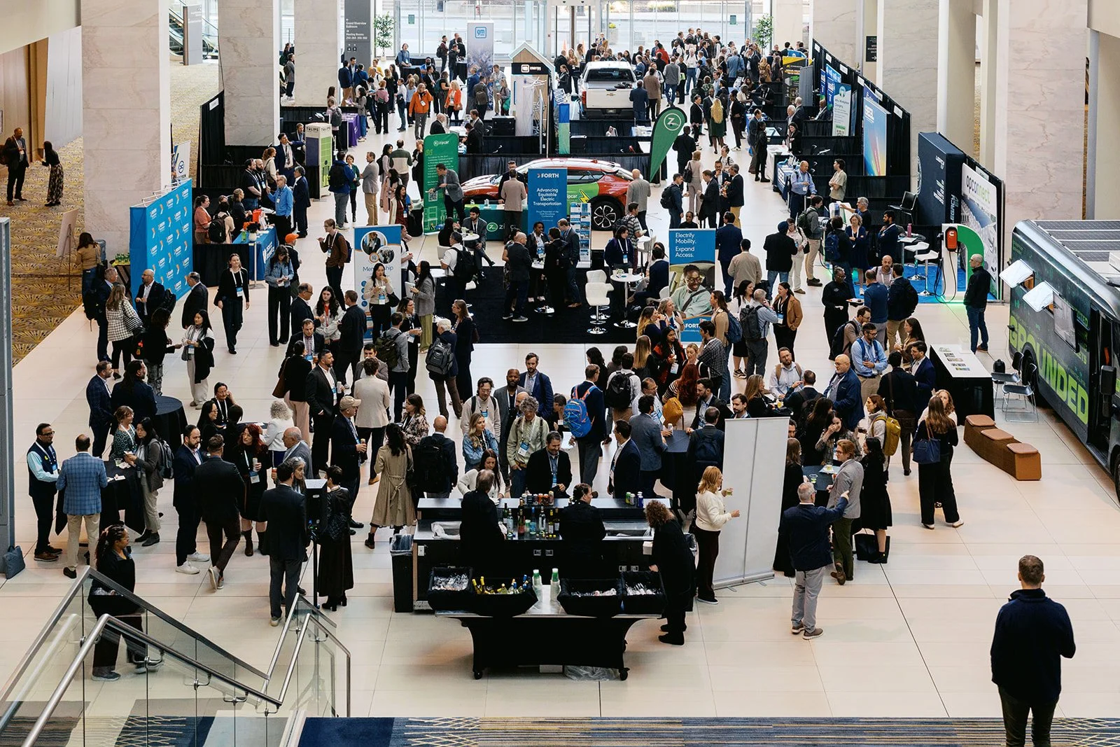 A large crowd of people indoors in an atrium, shot from above