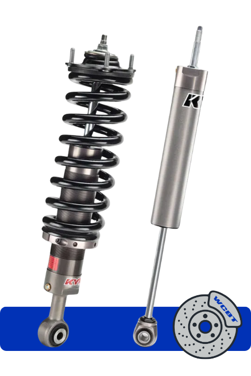 A KYB shock absorber and coil spring suspension component alongside a KYB gas-adjust shock absorber, and a brake rotor from Walnut Creek Brake and Tire