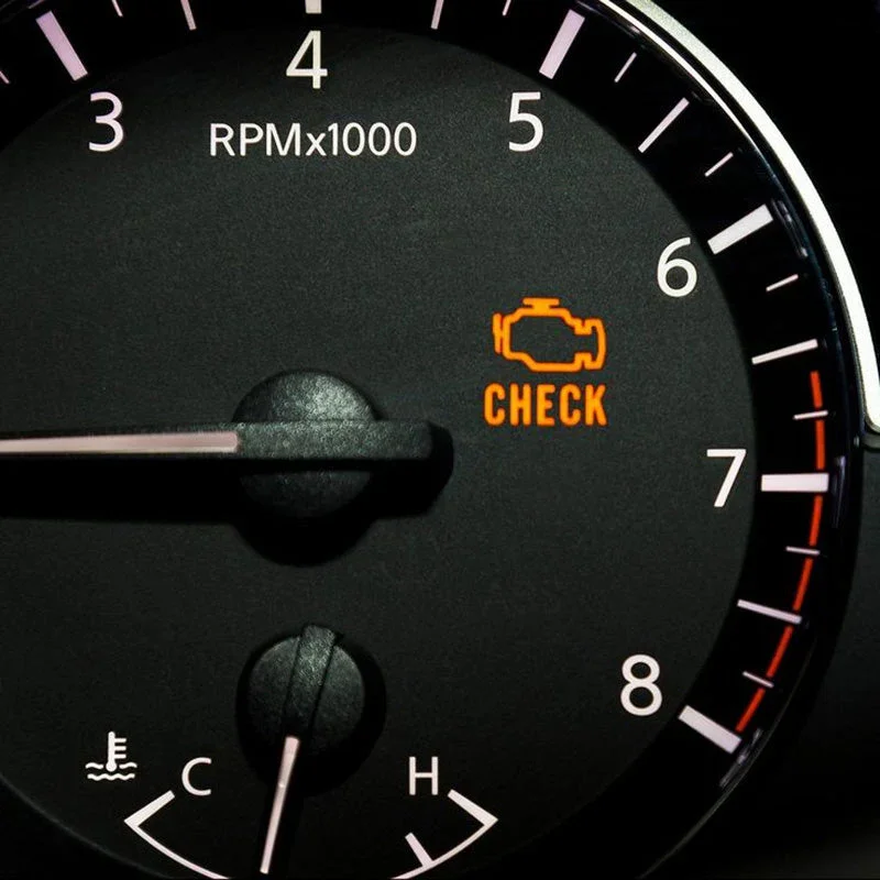 Car dashboard showing a check engine light illuminated with the word 'CHECK' and an engine outline, indicating a maintenance issue.