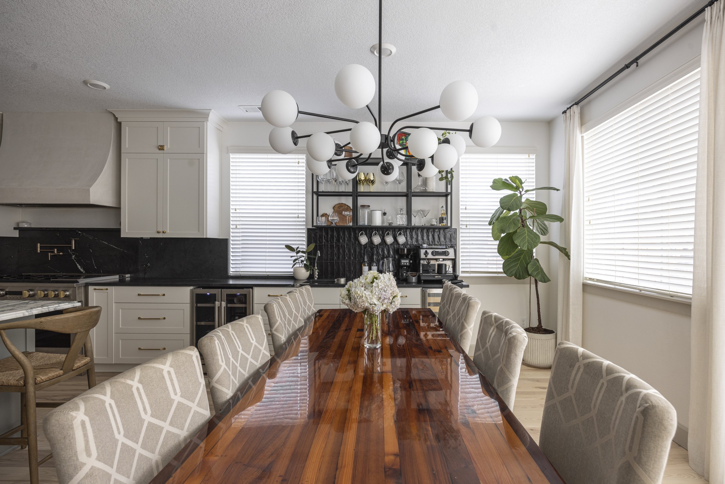 Dining room with wood table, globe chandelier, and built-in bar shelving, Portland, Oregon