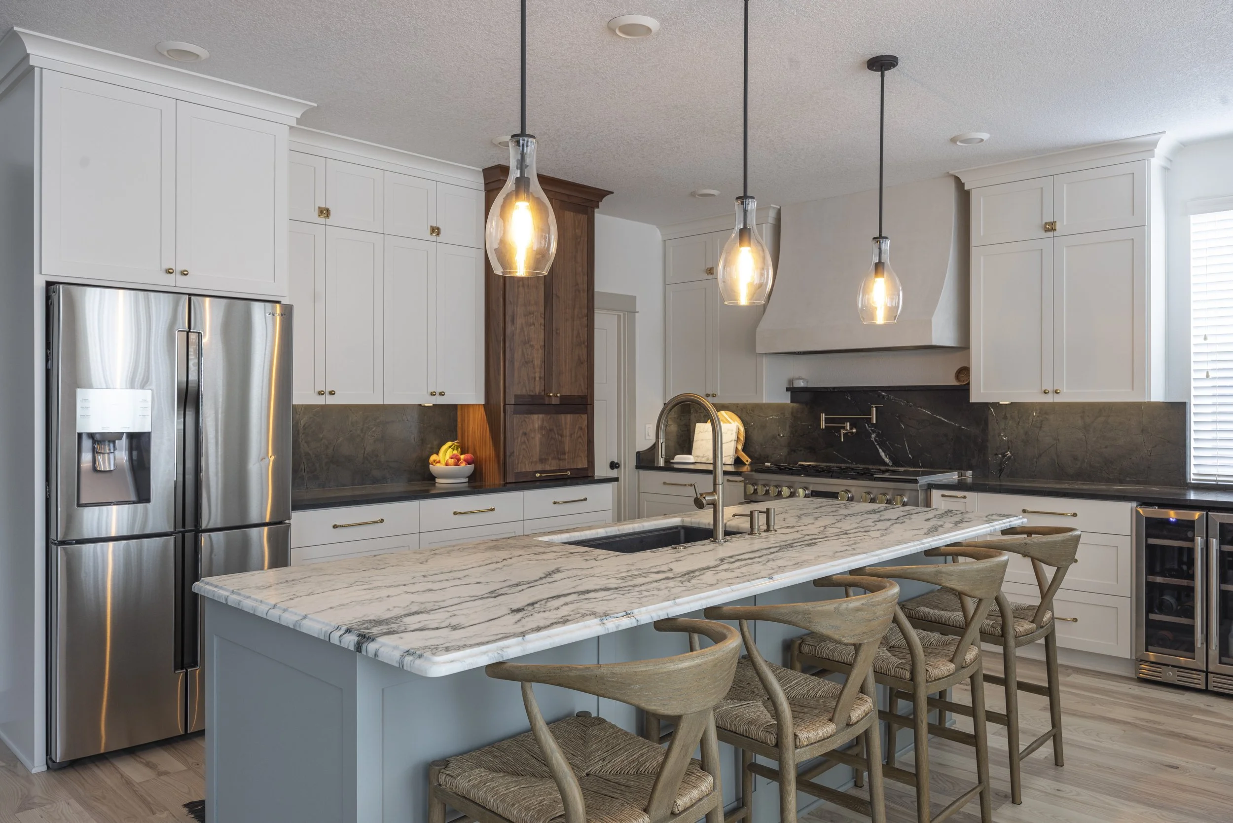 Kitchen island with marble countertop, Farrow & Ball Pigeon cabinetry, and pendant lighting, Portland, Oregon
