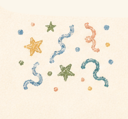 Colorful confetti in star, curly, and dot shapes on a white background.
