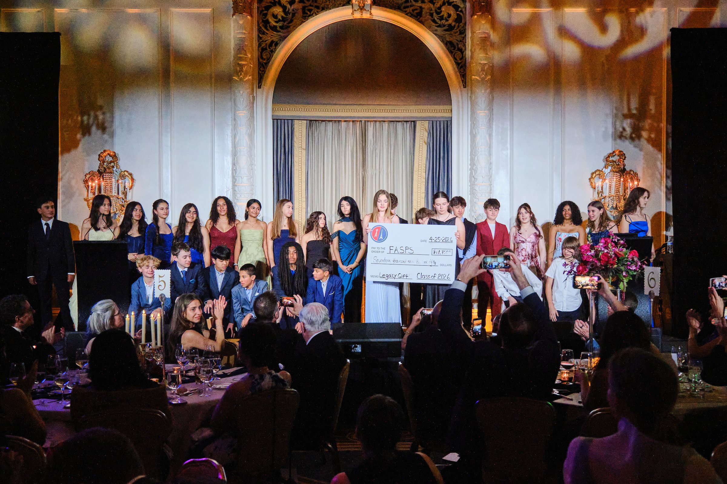 Grade 8 students present FASPS with a legacy check