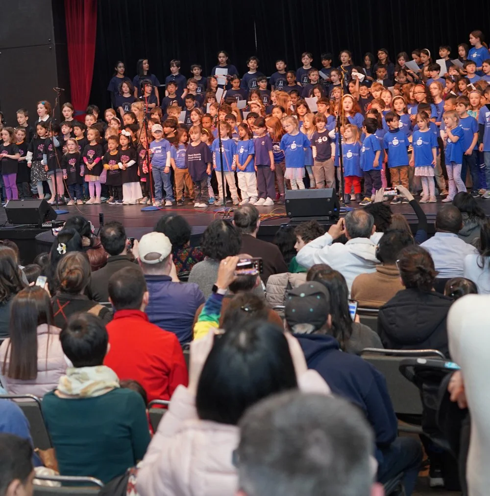 groups of kids from all four French schools on stage at FrenchFest
