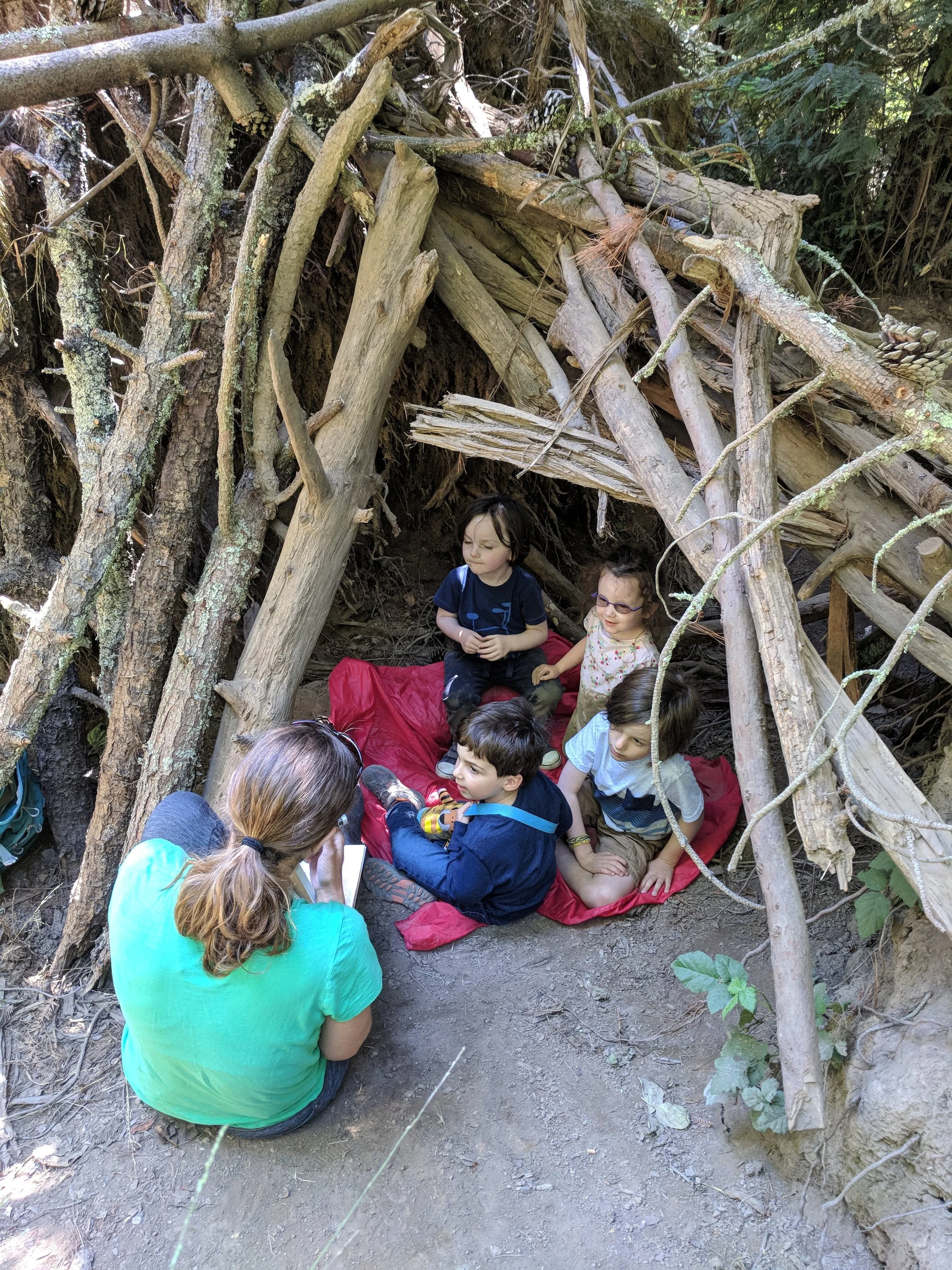 reading a book in the fort.jpg
