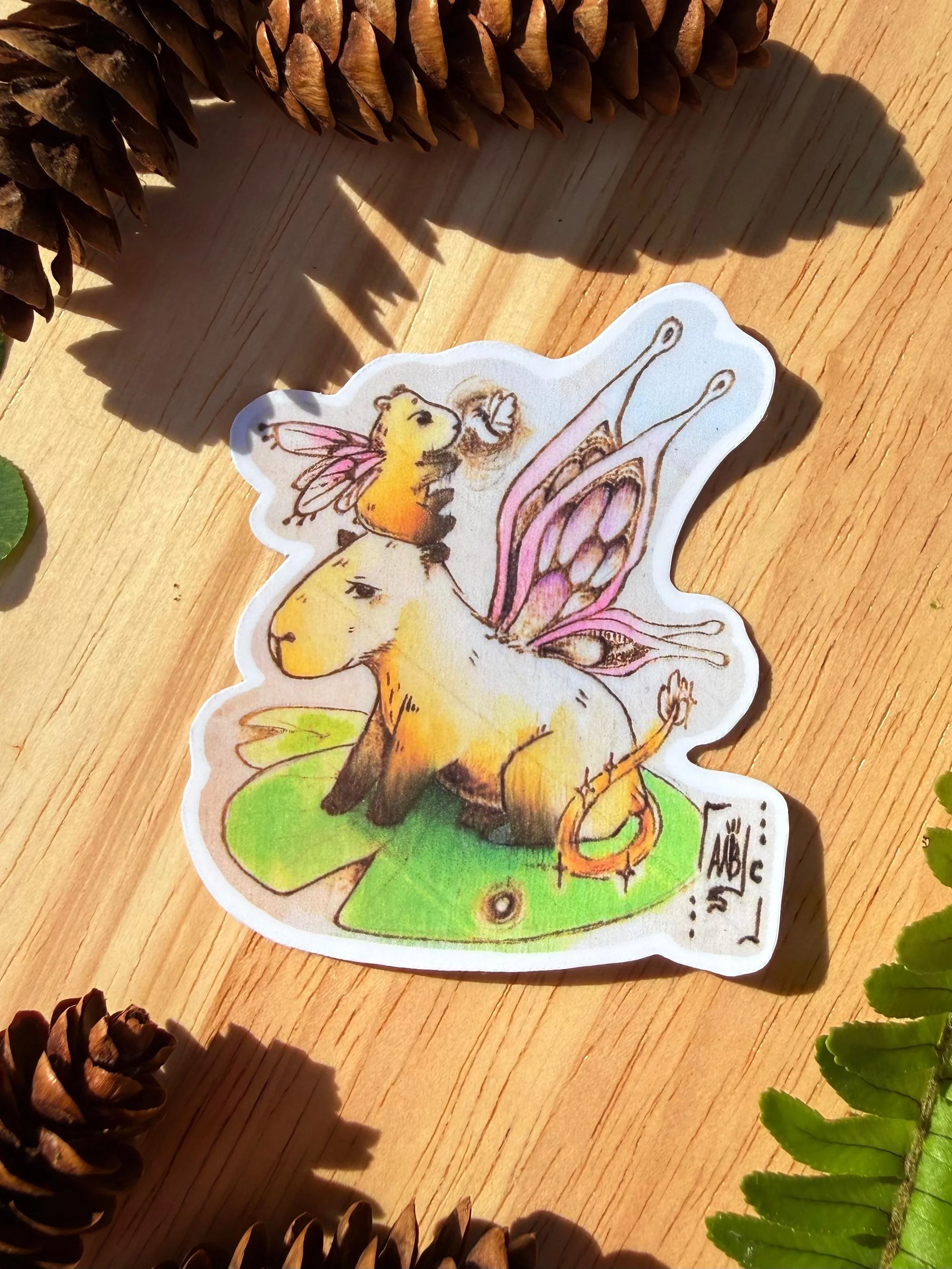 wood burned Fairy capybara sticker.jpeg