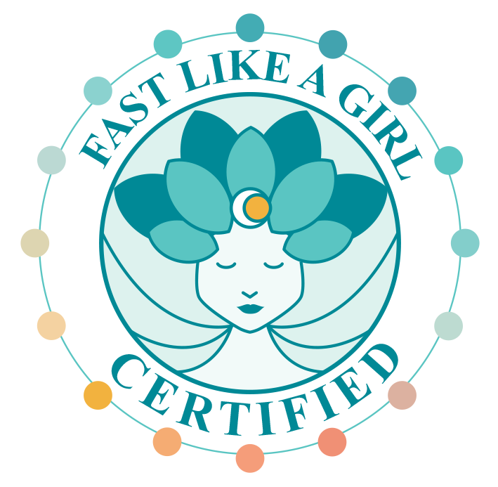 A circular logo with the text 'Fast Like a Girl Certified' surrounding a stylized female face with closed eyes, featuring a flower with leaves as hair and a small yellow circle on the forehead.