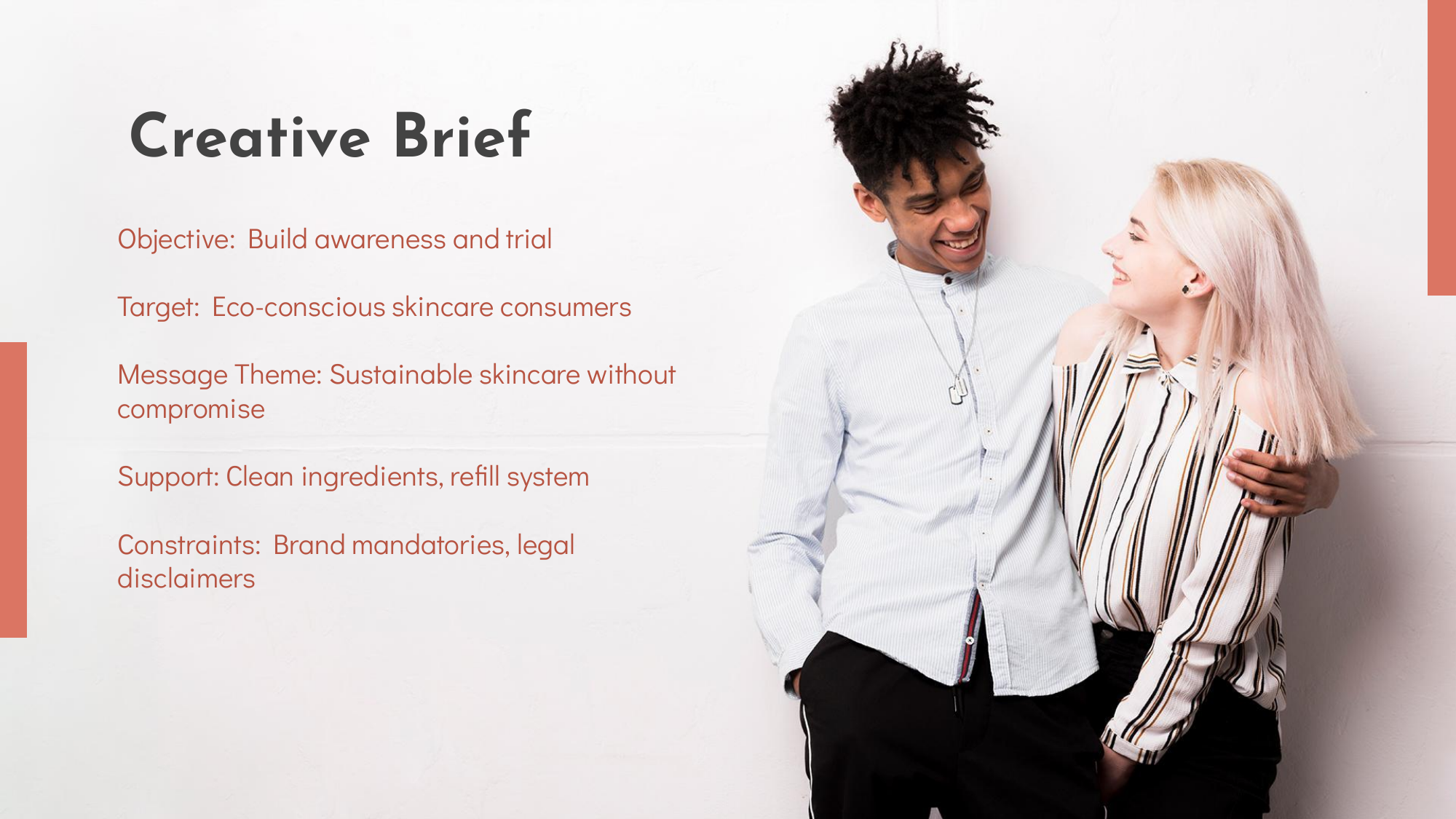 A young man and woman smiling and embracing each other against a white wall, with a presentation slide titled 'Creative Brief' on the left side outlining objectives, target audience, message theme, support, and constraints.