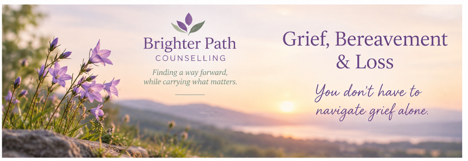 A calming scene of purple flowers and a sunset over hills, promoting grief and loss counseling services with text about navigating grief.