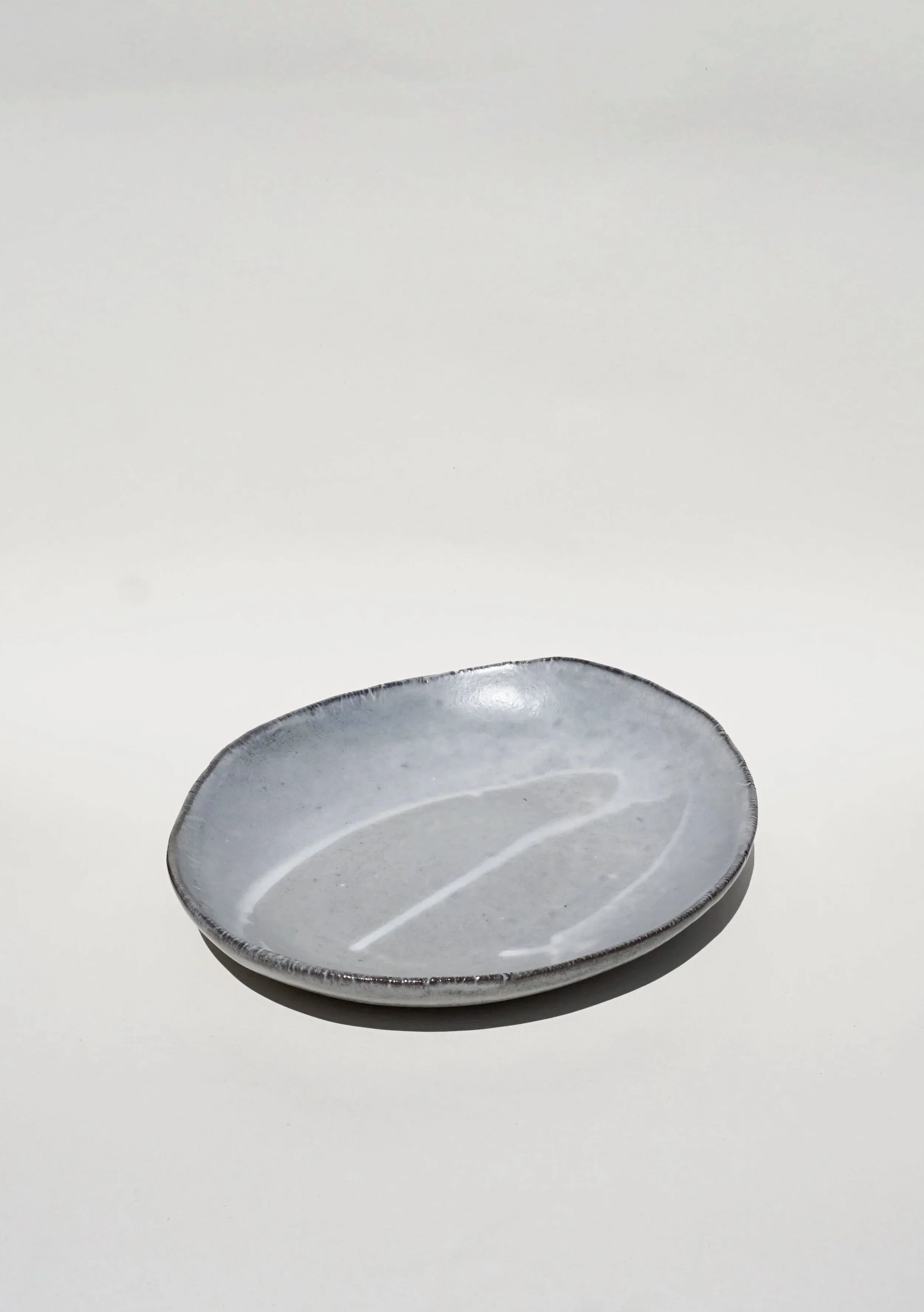 Slipped black porcelain oval serving platter 