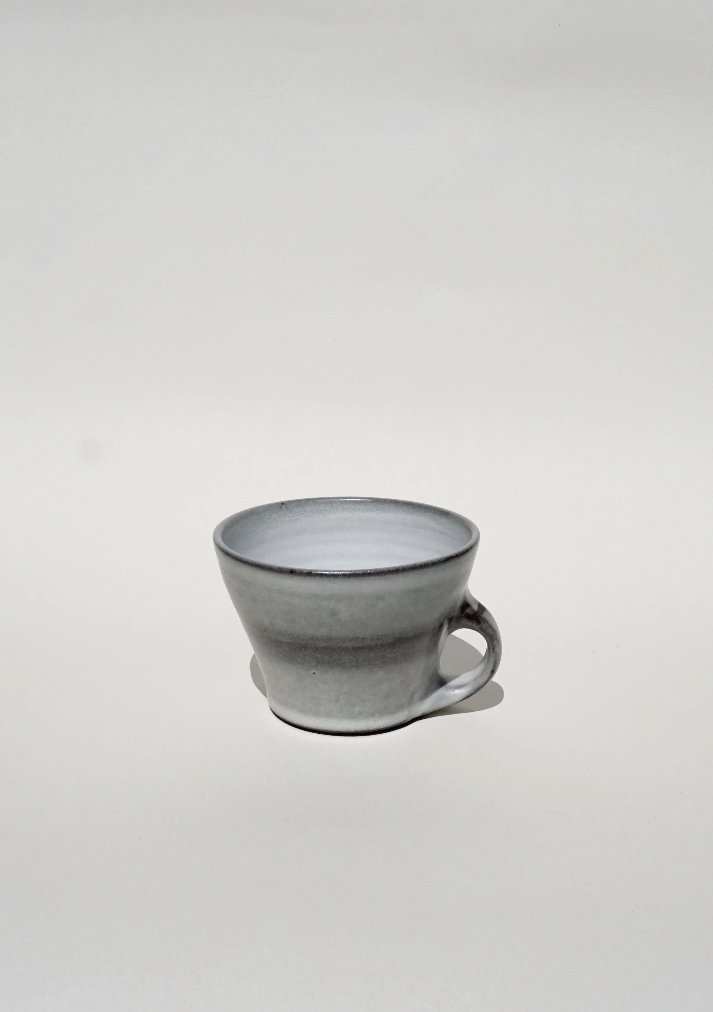 Black porcelain coffee mug with a soft grey finish 