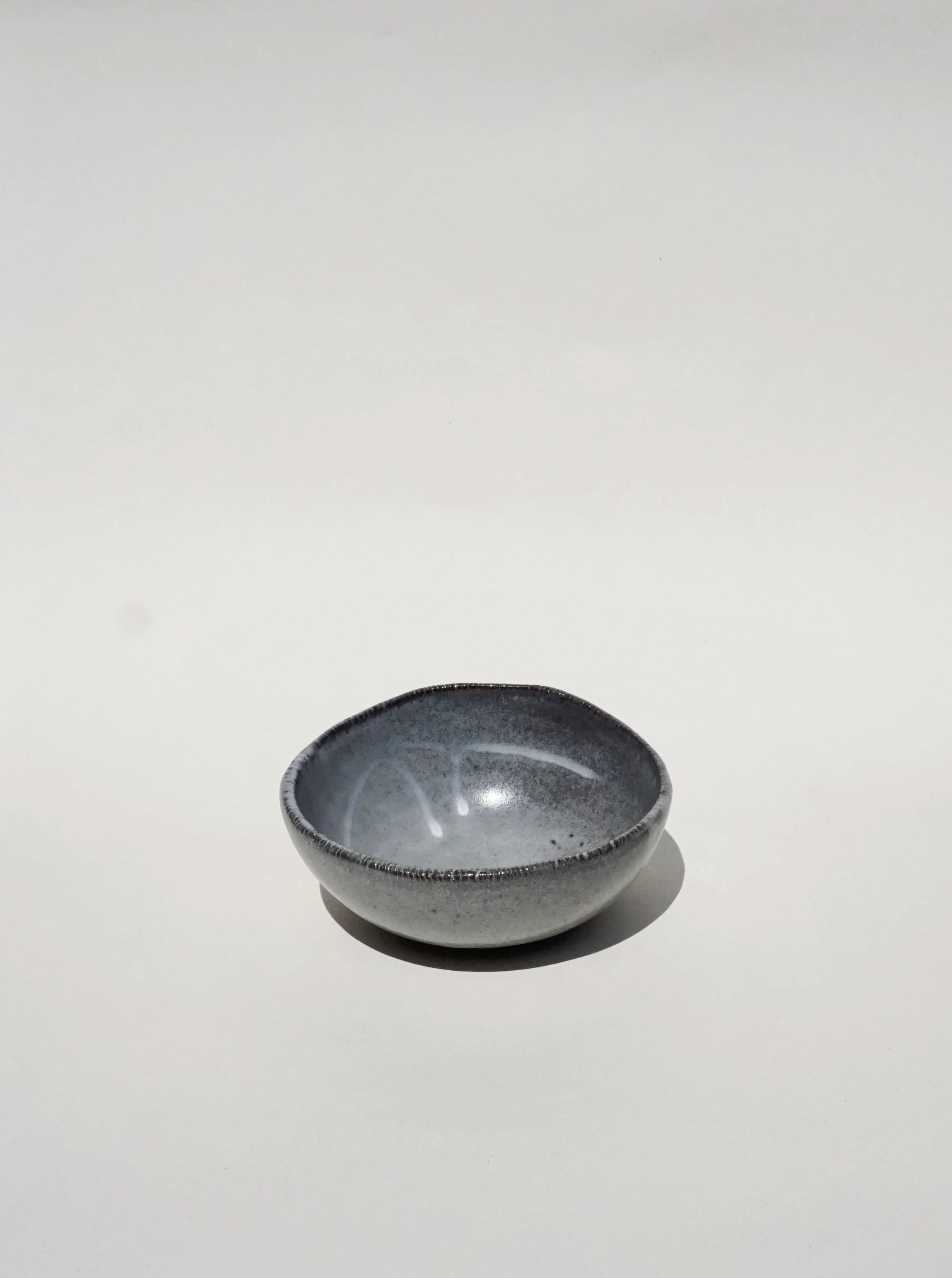 Hand crafted breakfast bowl in black porcelain with a soft grey finish 