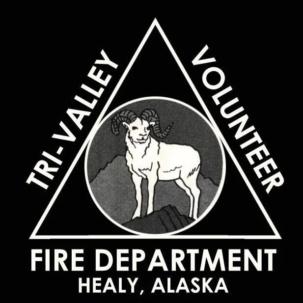 Tri-Valley Volunteer Fire Department logo with a mountain goat in a circle, surrounded by the text 'Tri-Valley Volunteer Fire Department Healy, Alaska' within a triangle.