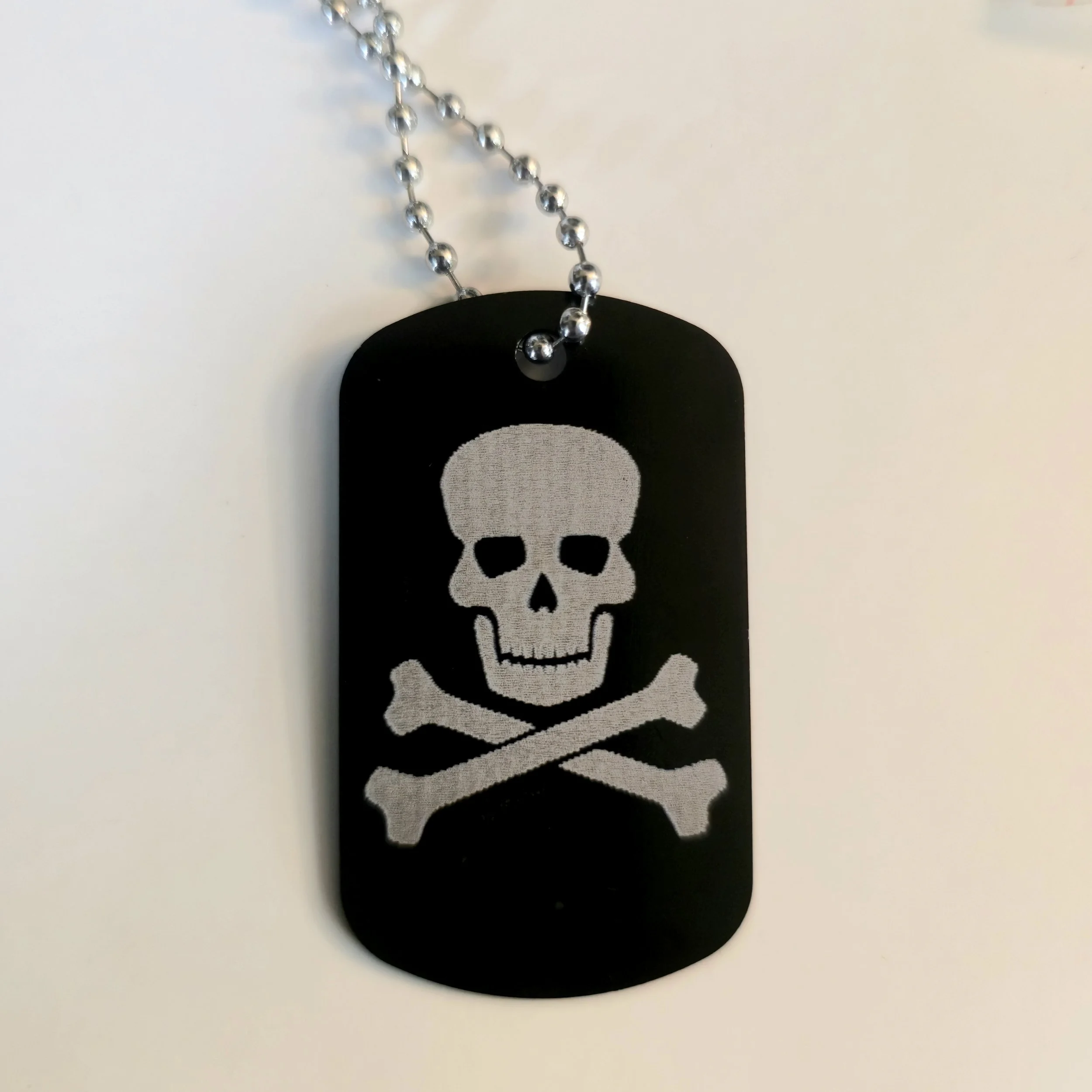 CLEARANCE/MISPRINT Metal Dog Tag - Skull And Crossbones