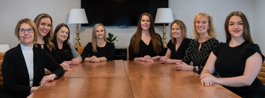 Corporate group posing inside office building